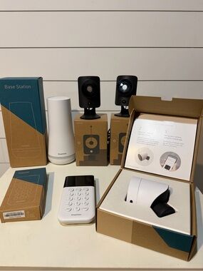 SimpliSafe white and black security camera kit with base station